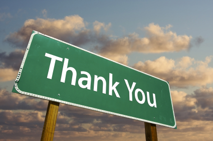 Thank You Green Road Sign with dramatic clouds and sky.