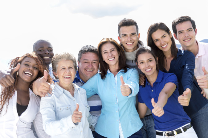 Happy group of people with thumbs up