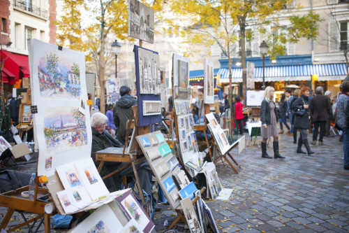 PARIS, FRANCE - November 23, 2014: Artists in Place du Tertre. Many artists set up their easels each day for the tourists in this famous and picturesque square in Montmartre